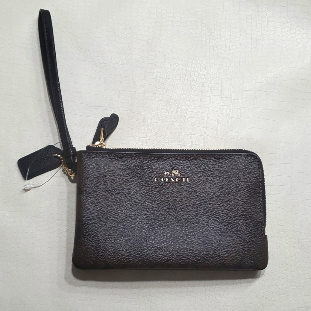 Double corner zip Coach wristlet. Signature brown water repellent fabric.
